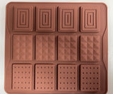 A brown, solid-colored mini chocolate bar mould with multiple compartments.