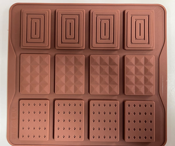 A brown, solid-colored mini chocolate bar mould with multiple compartments.